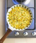 Sweetcorn omelette in pan — Stock Photo