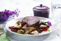 Fillet of beef on vegetables — Stock Photo