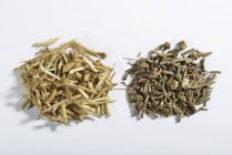 Closeup view of fresh and dried chopped valerian root — Stock Photo