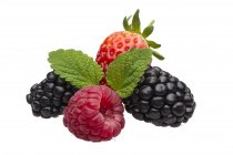 Raspberries with blackberries and strawberries — Stock Photo