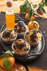 Chocolate muffins with mandarin syrup — Stock Photo