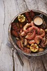 Roasted shrimps with grilled sausages — Stock Photo