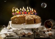 Birthday honey cake with walnuts — Stock Photo