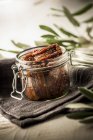 Dried tomatoes in jar — Stock Photo