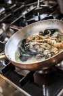 Seafood cooking in white wine — Stock Photo