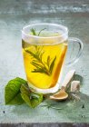 Orange tea with rosemary — Stock Photo