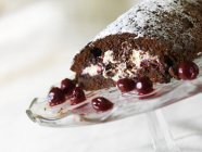Closeup view of gluten-free chocolate and cherry roulade — Stock Photo