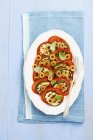 Tomato salad with olives and grilled courgette — Stock Photo