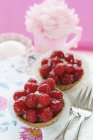 Strawberry tartlets and cake forks — Stock Photo