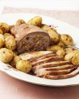 Roasted stuffed beef with potatoes — Stock Photo