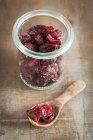 Dried cranberries in jar — Stock Photo