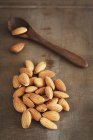 Almonds on a wooden surface — Stock Photo