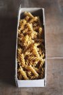 Raw wholemeal fusilli pasta — Stock Photo