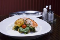 Grilled salmon with potatoes and spinach — Stock Photo