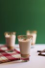 Closeup view of cinnamon drinks in glasses — Stock Photo