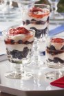 Closeup view of Parfait with cream, strawberries and blueberries — Stock Photo
