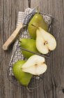 Green pears in wire basket — Stock Photo