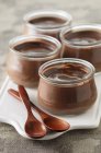 Chocolate pudding in glass jars — Stock Photo