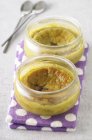 Warm pistachio cakes in jars — Stock Photo