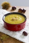 Closeup view of autumnal chestnut soup on white cloth — Stock Photo