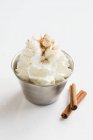 Closeup view of whipped cream with ground cinnamon — Stock Photo