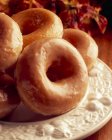 Glazed doughnuts on plate — Stock Photo