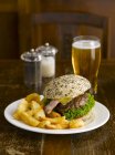 Hamburger with fries and beer — Stock Photo
