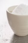 Closeup view of Xylitol in white bowl — Stock Photo