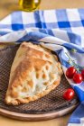Pizza pocket with tomatoes — Stock Photo