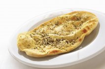 Naan bread with garlic — Stock Photo