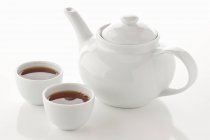Asian tea in teapot and tea bowls — Stock Photo