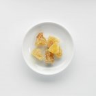 Top view of candied ginger pieces on plate — Stock Photo