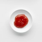 Porción de mermelada de frambuesa en un tazón - foto de stock