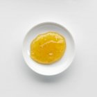 Portion of apricot jam in bowl — Stock Photo