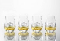 Glasses of whiskey with ice cubes — Stock Photo