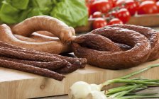 Various sausages on board — Stock Photo
