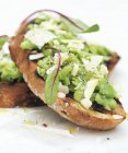 Bruschetta topped with beans — Stock Photo