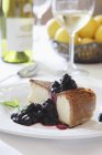 Cheesecake with compote on plate — Stock Photo
