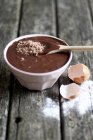 Bowl of brownie batter with wooden spoon — Stock Photo