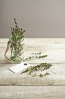 Jar of thyme herb — Stock Photo