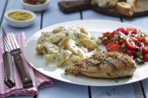 Grilled chicken breast with potato salad — Stock Photo
