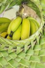 Bananas in woven basket — Stock Photo