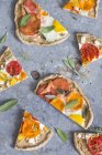 Pieces of wholemeal pizza with tomatoes — Stock Photo