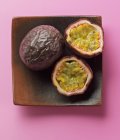Passion fruits in wooden dish — Stock Photo