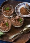 Chocolate mousse with mint leaves — Stock Photo