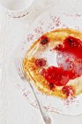 Pancake with raspberry sauce — Stock Photo