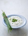 Closeup view of quark with chive bunch — Stock Photo