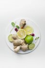 Lemons with limes and ginger — Stock Photo