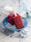 Melon and blueberry ice lollies — Stock Photo