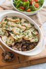 Baked mushrooms and potatoes with herbs — Stock Photo
